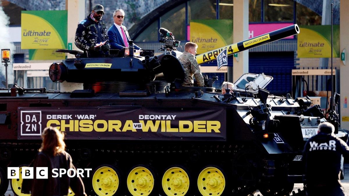 Chisora vs Wilder: Chisora arrives at news conference in a tank with Nigel Farage