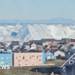 Giant iceberg turns over near Greenland’s coast