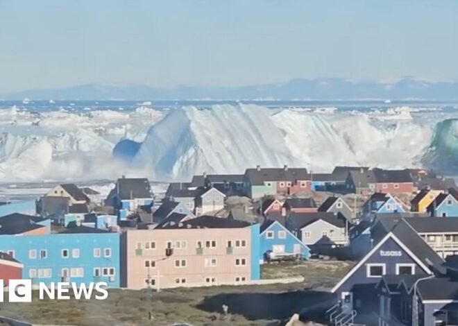 Giant iceberg turns over near Greenland’s coast