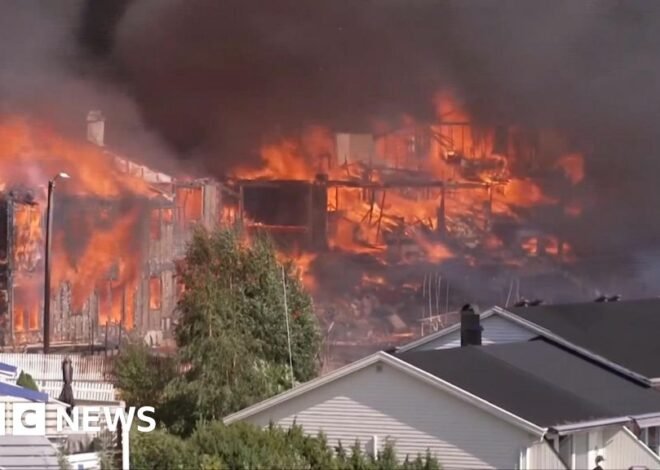 Helicopters dump water as huge Norway fire destroys homes