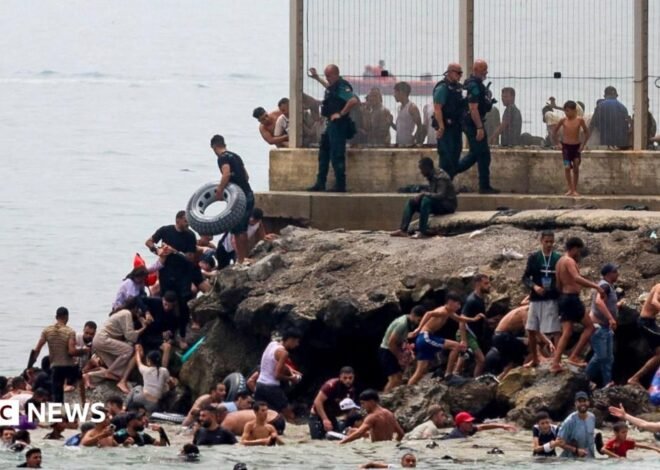 Hundreds of migrants swim from Morocco to Spanish enclave of Ceuta