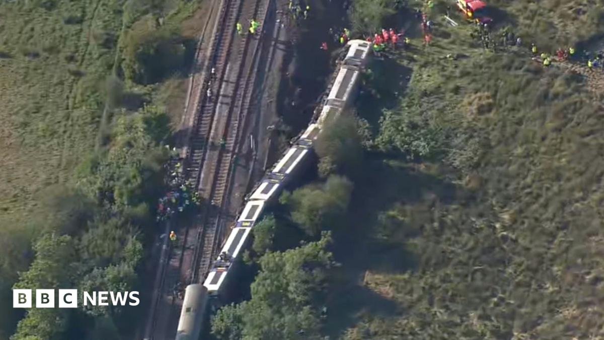 Aerial footage shows derailed train