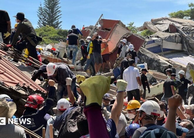 Anguish of Colombian brother at rubble of building being searched for earthquake survivors