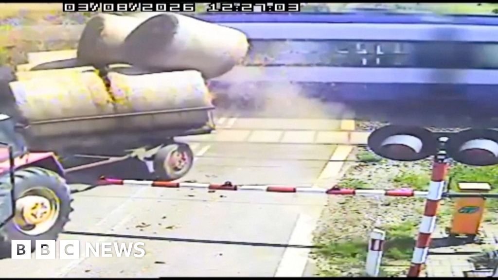 Watch: Moment passenger train crashes with trailer carrying straw bales