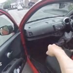 Woman gives police officer a lift in Nissan Micra while chasing man
