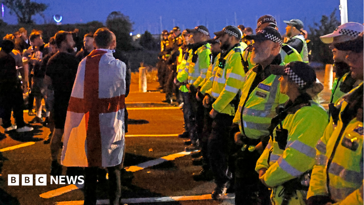 Protesters gather as migrants brought ashore at Gosport