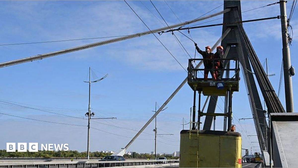 Kyiv bridge hit in further drone attack as German chancellor makes surprise visit
